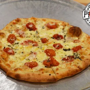 Our spin on the original white pizza with blistered cherry tomatoes and fresh basil.