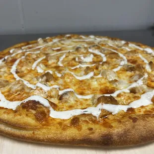 Tangy buffalo chicken pizza topped with house made ranch