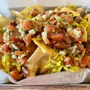 Smoked Brisket Nachos (Appetizers section). THE BEST NACHOS EVER, HANDS DOWN. The chopped pepperoncini truly makes this dish.