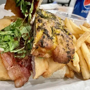 Crispy Apple Jack Chicken Sandwich - apple butter spread, pepper jack cheese, arugula on a toasted herb focaccia.