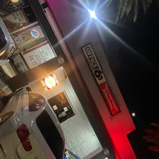 a car parked in front of a gas station