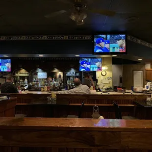 people sitting at the bar