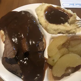 Open faced roast beef, mashed potatoes, and fried apples.