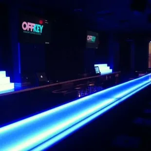 Main bar changes colors and the lyrics are displayed on the big TVs for all to see.