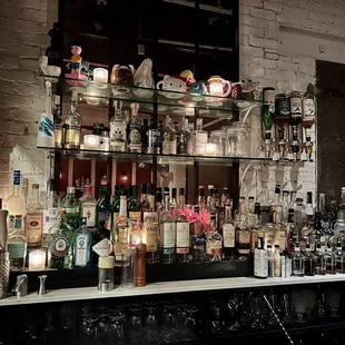 a bar filled with bottles of alcohol