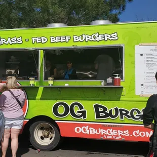 people ordering food from a food truck