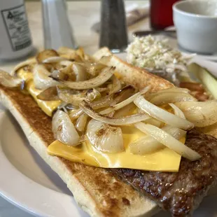 a hot dog with onions and cheese