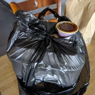 a plastic bag and a cup of coffee