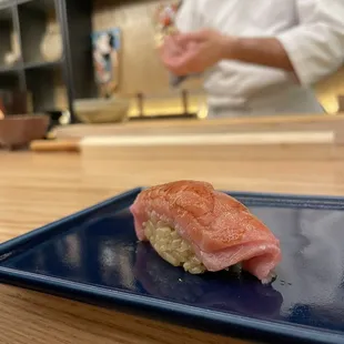 a sushi on a blue plate