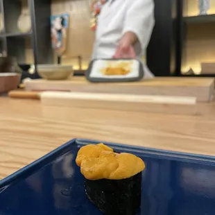 a sushi on a blue plate