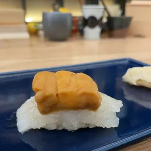 a plate of sushi and a banana