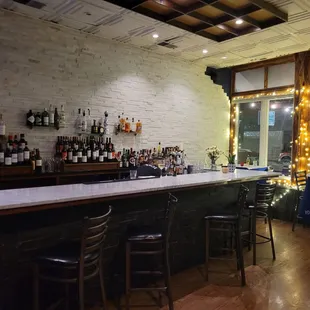 a bar with a lot of bottles