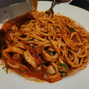 Linguine Alla Pescatore (linguini with fresh shrimp, calamari and chopped clams sautéed in special marinara sauce).