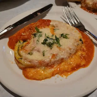 Rotolo Primavera Tricolored pasta stuffed with ricotta cheese and spinach baked in red cream