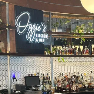 Loved the custom sign behind the bar!