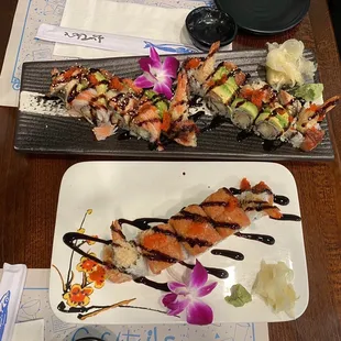 two plates of sushi and a glass of water