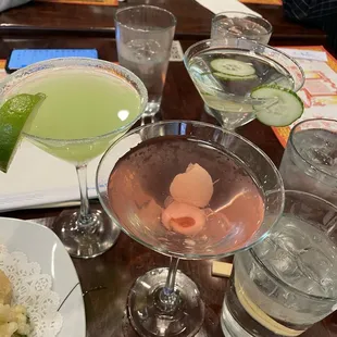 Lychee martini (pink), apple pear martini (green), sake martini (clear)