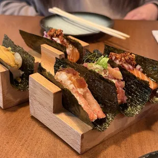 Hand rolls: Uni scallop, salmon w chili crisp, snow crap w ponzu, toro