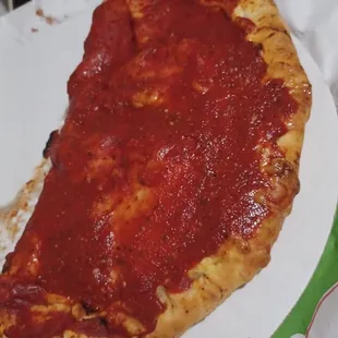 Calzone 18 bucks outside inside was slimy under cooked dough