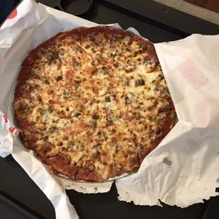 Sausage and hot giardiniera pepper pizza delivered piping hot.