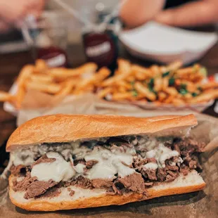 a steak sandwich and french fries