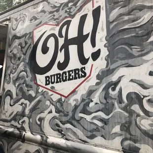a man standing in front of a food truck