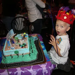 tyler's 3rd birthday cake- toy story theme, eating the black frosting!