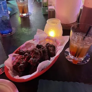 a plate of meat and a drink