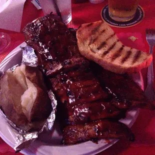 Full slab of ribs baked potato SO GOOD!!!!