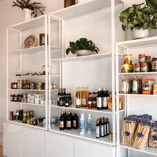 a shelf of food and condiments