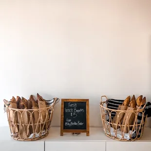 two baskets of bread on a shelf