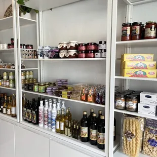 a shelf full of food and condiments