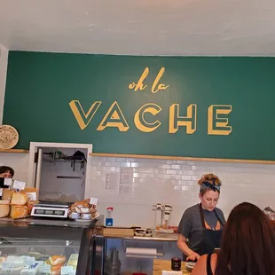 a woman working behind a counter