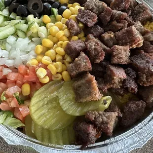 BEEF GYRO PLATTER sauce is on the side.