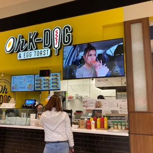a woman standing in front of the counter