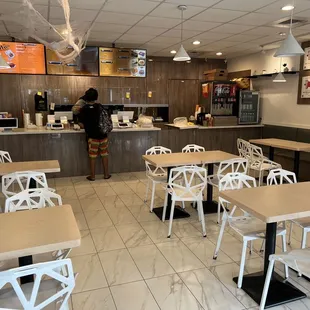 a restaurant with tables and chairs