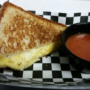 a grilled cheese sandwich with tomato sauce