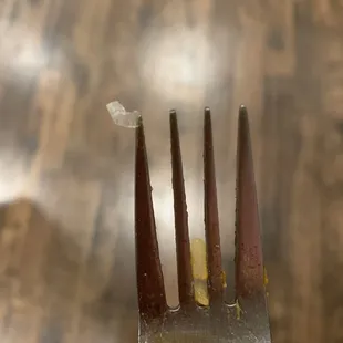 The piece of plastic I found in my mouth when I was eating my Sushi.