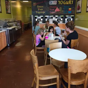 a group of people sitting at a table