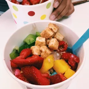 Froyo for that 100-degree weather. Belgian Chocolate &amp; Dulce De Leche with fruit + cheesecake bites + sour worms