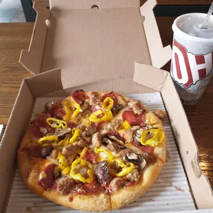 The Founder pizza with Diet Pepsi