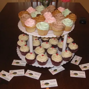 a tower of cupcakes on a table