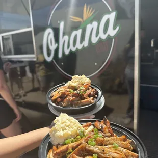 two plates of food being served