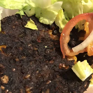 a plate of food with lettuce and tomato