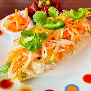 a plate with a sandwich and salad