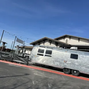 a vintage airstream parked in a parking lot
