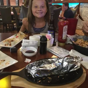 a girl eating a meal