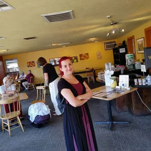 a woman standing in a restaurant