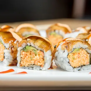 four pieces of sushi on a plate