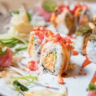 a plate of sushi rolls